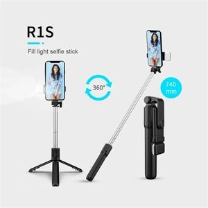 Adjustable length selfie stick with light and remote